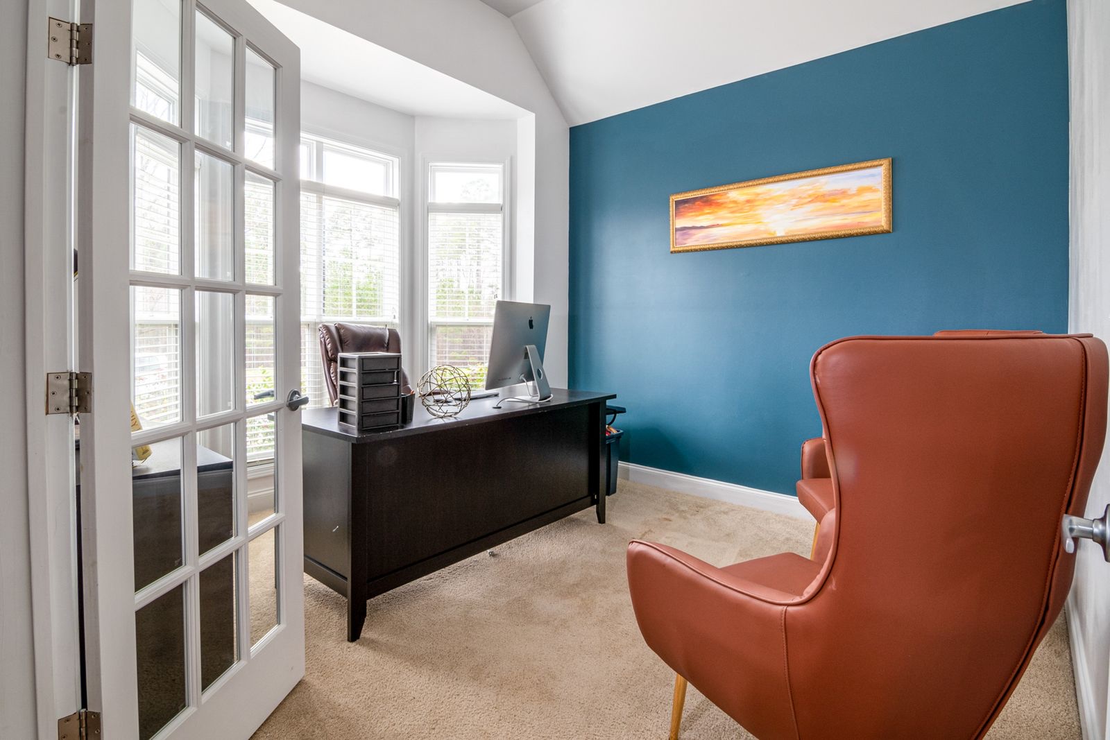 A garage conversion home office with a garden view by Professional Polish Builders in Croydon & South London