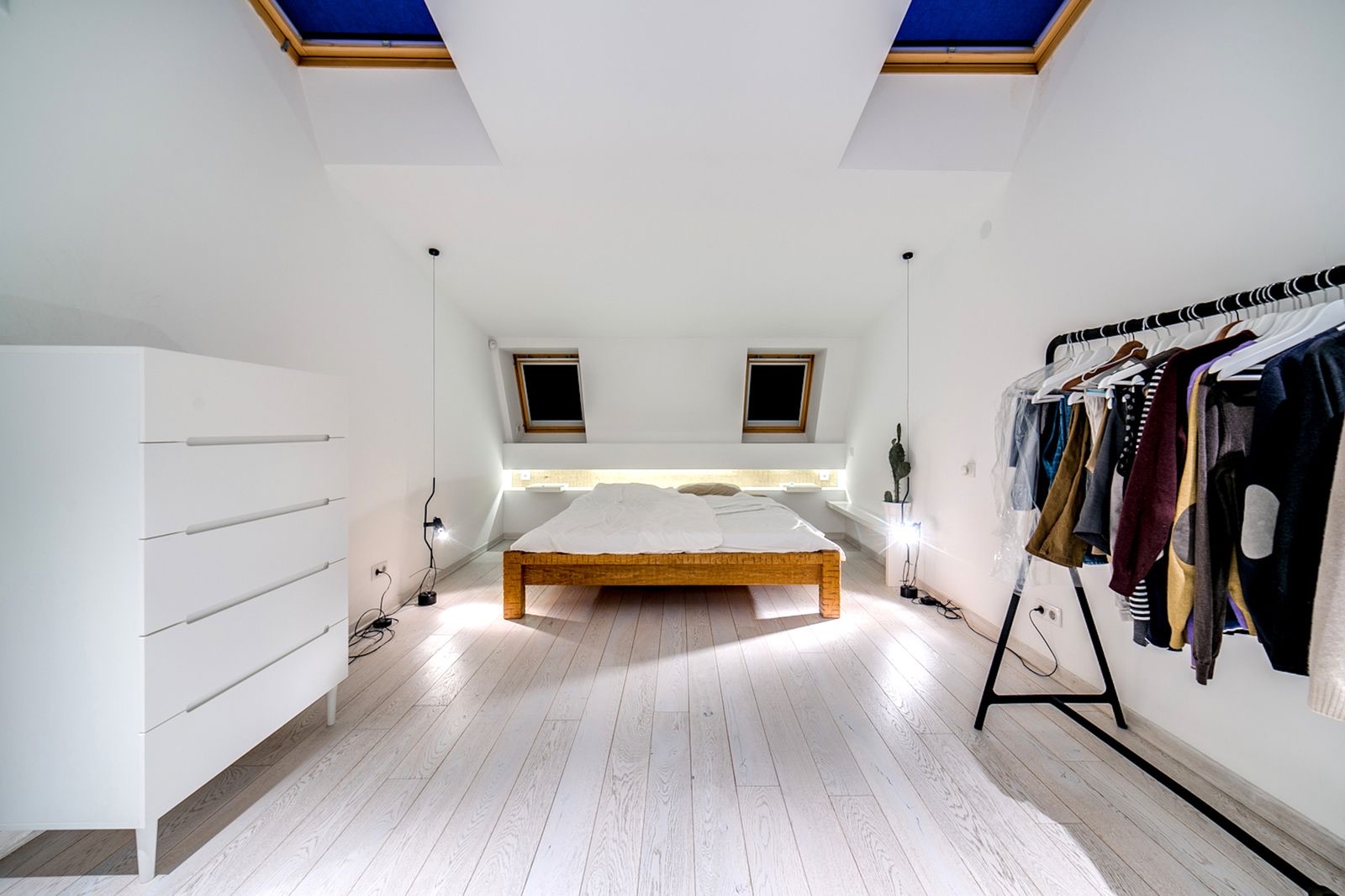 A modern white loft conversion bedroom by Professional Polish Builders in Croydon & South London