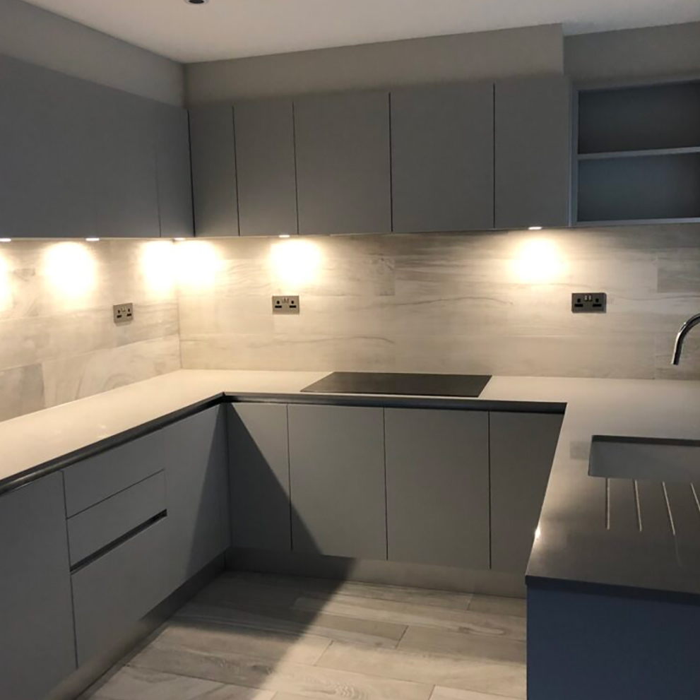 A handleless grey kitchen by Professional Polish Builders in Croydon & South London